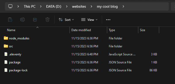 The folder 'my cool blog' folder showing a folder named node_modules, a folder named src, a file named .eleventy.js, a file named package.json, and a file named package-lock.json